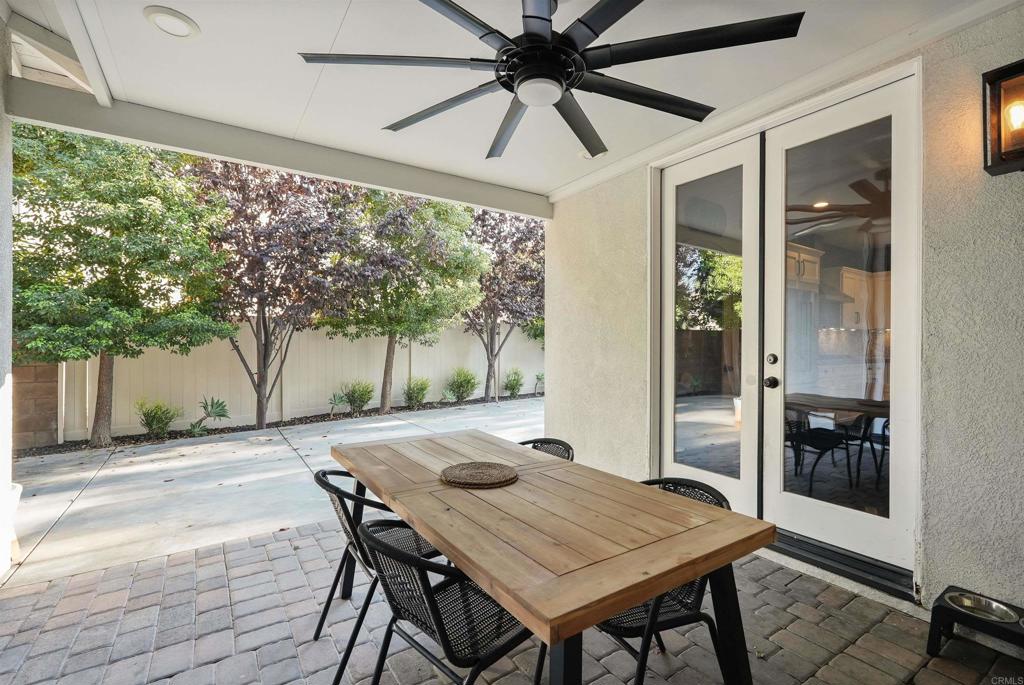 25351 Forest Street Corona, CA 92883 - Photo 52 of 72 a patio with table and chairs and potted plants