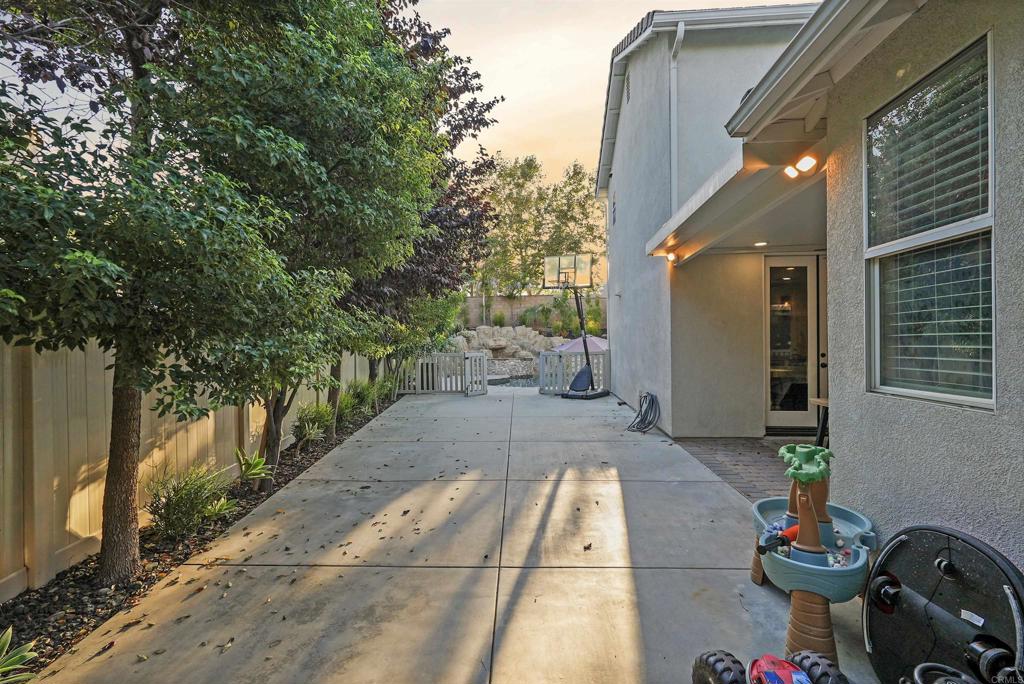 25351 Forest Street Corona, CA 92883 - Photo 63 of 72 a view of a patio with table and chairs and potted plants