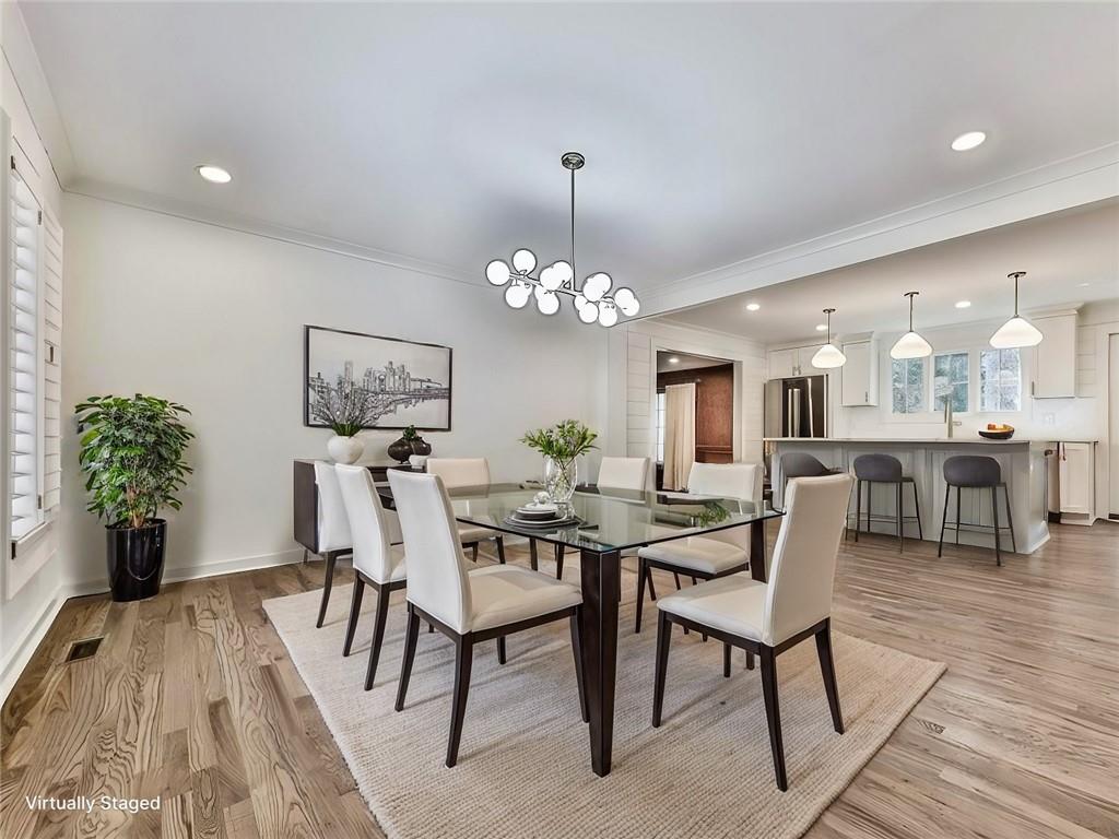 633 Butterworth Road Canton, GA 30114 - Photo 5 of 55 a view of a dining room with furniture and wooden floor