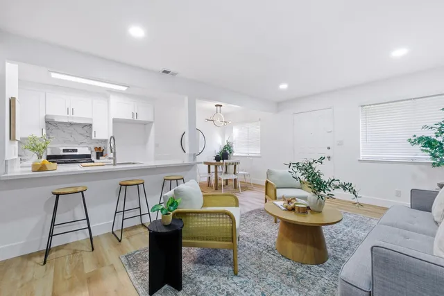 a very nice looking living room with a couch and a table