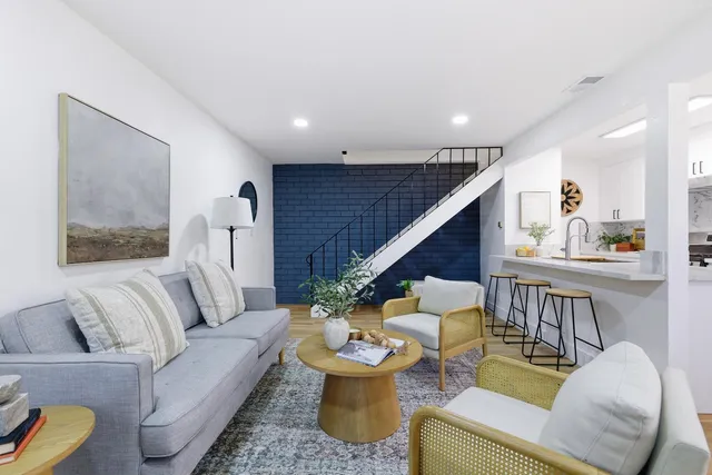 a living room with furniture and white walls