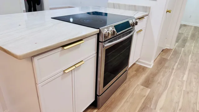 a view of kitchen island with a sink and dishwasher