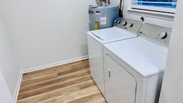 a bathroom with a sink a toilet and bathtub