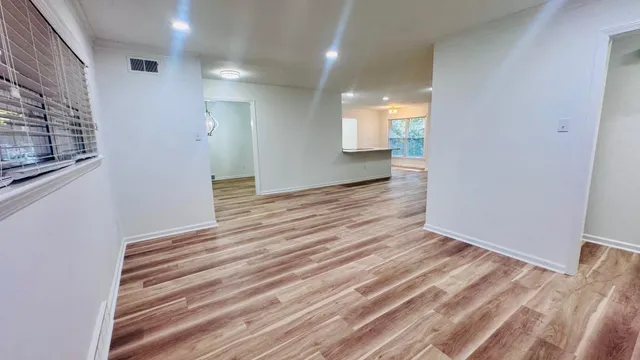 a view of an empty room with a fireplace