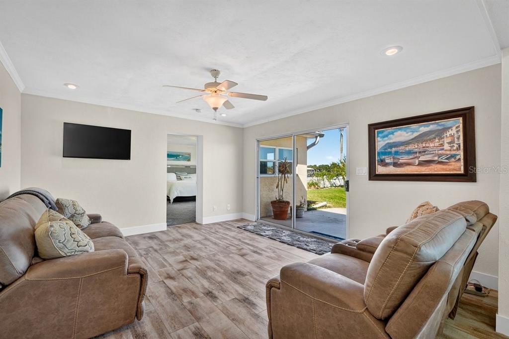 450 Lambert Avenue Flagler Beach, FL 32136 - Photo 24 of 41 a living room with furniture and a flat screen tv