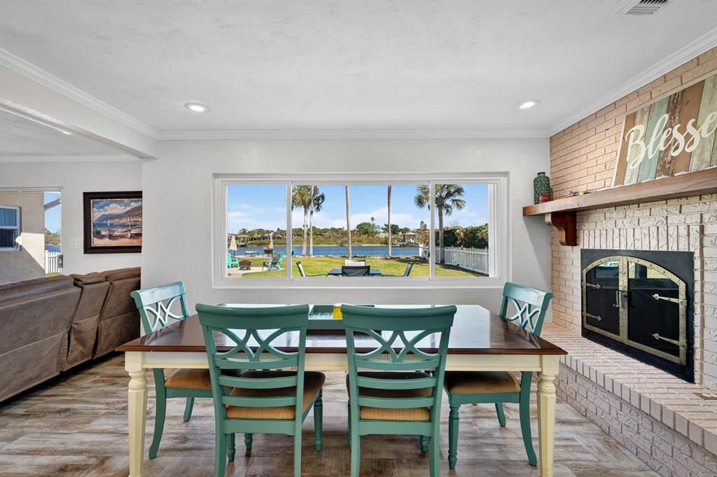 450 Lambert Avenue Flagler Beach, FL 32136 - Photo 28 of 41 a view of a dining room with furniture window and wooden floor