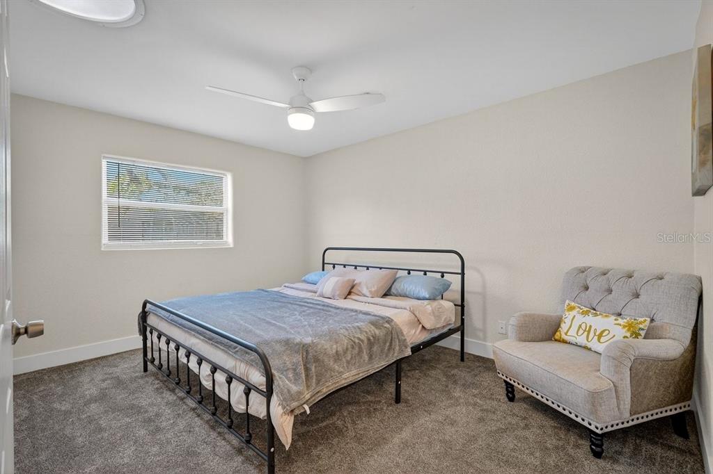 450 Lambert Avenue Flagler Beach, FL 32136 - Photo 9 of 41 a bed room with a bed and a couch