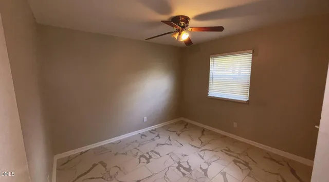 a view of a room that has a window in it