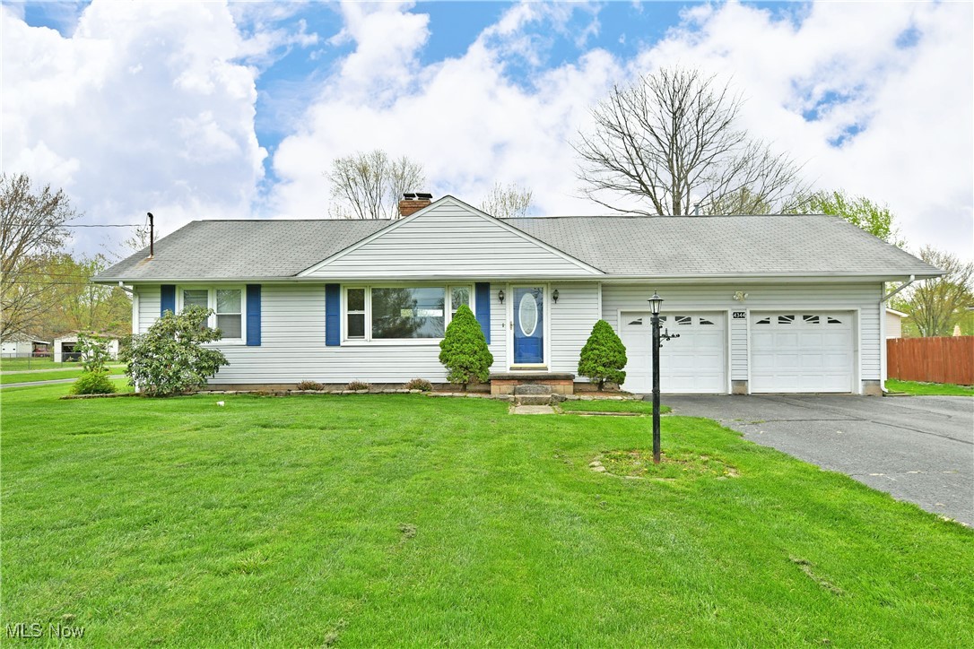 4344 Ridge Road Cortland, OH 44410 - Photo 1 of 1 Single story home featuring driveway, a chimney, fence, a front lawn, and an attached garage