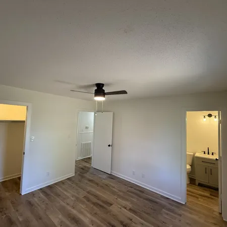 an empty room with wooden floor