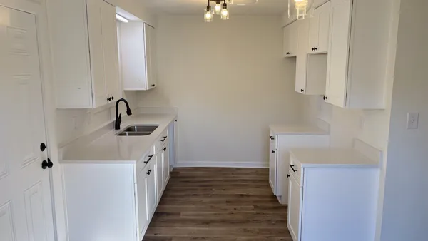 a kitchen with a sink and cabinets