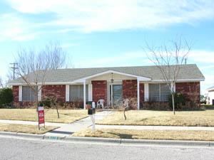 a view of a house with a garden