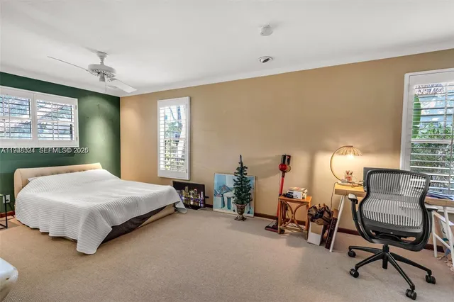 a bedroom with a bed and a chair