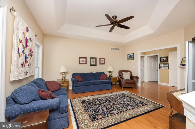 a living room with furniture and a rug