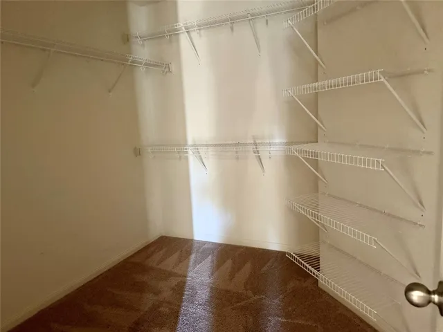 an empty room with a empty space and windows