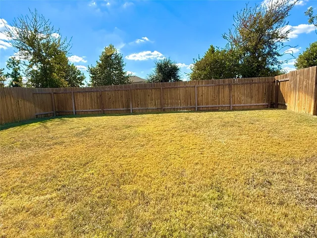 a view of a kitchen from the hallway