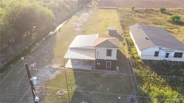 an aerial view of a residential building and an outdoor space