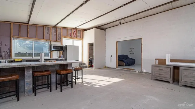 a room with furniture a window and a sink