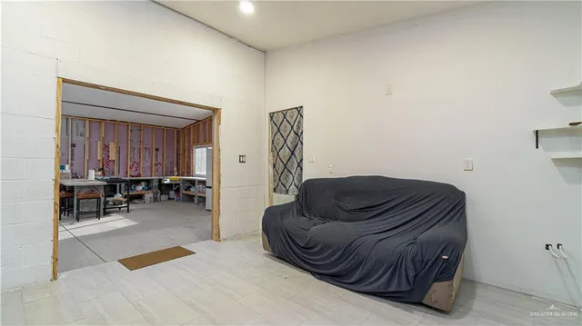 a living room with furniture and a chair