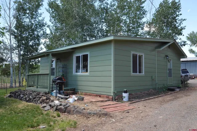 a backyard of a house with lots of green space