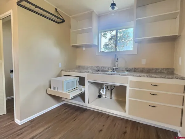 a room with cabinets and a wooden floor