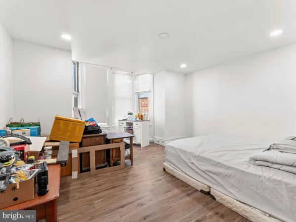 a bed room with a bed and a book shelf