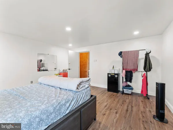 a room with a bed and a flat screen tv