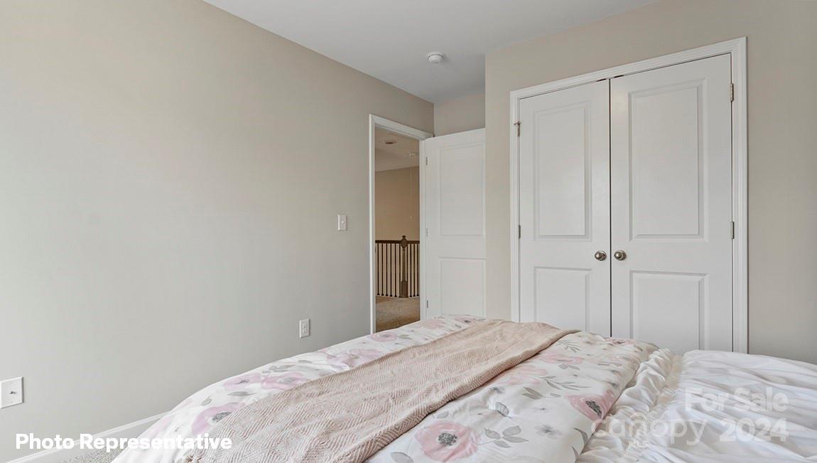 308 Streamwood Road Troutman, NC 28166 - Photo 20 of 39 a bedroom with a bed and a window