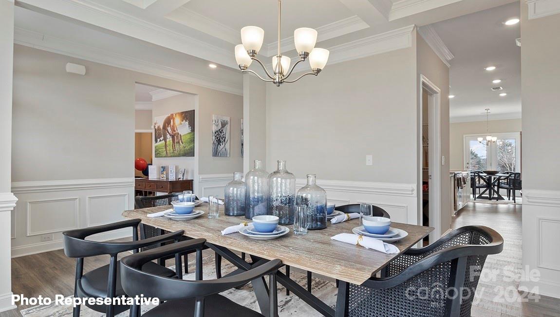 308 Streamwood Road Troutman, NC 28166 - Photo 2 of 39 a view of a dining room with furniture and chandelier