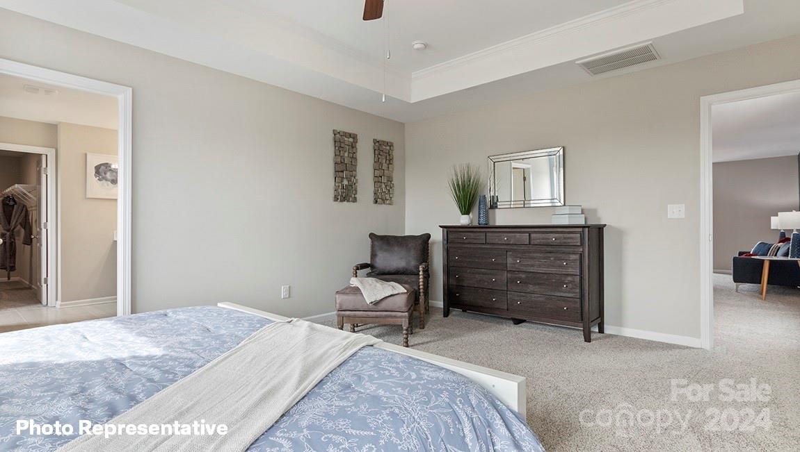 308 Streamwood Road Troutman, NC 28166 - Photo 27 of 39 a bedroom with a bed and a cabinets