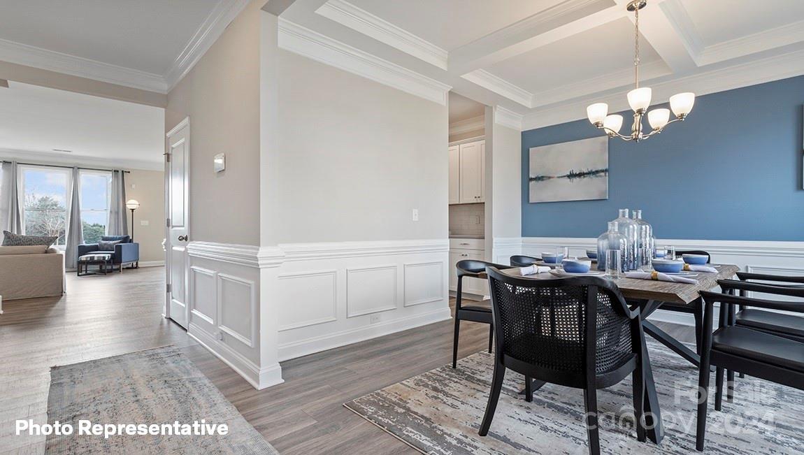 308 Streamwood Road Troutman, NC 28166 - Photo 3 of 39 a view of a dining room with furniture and wooden floor