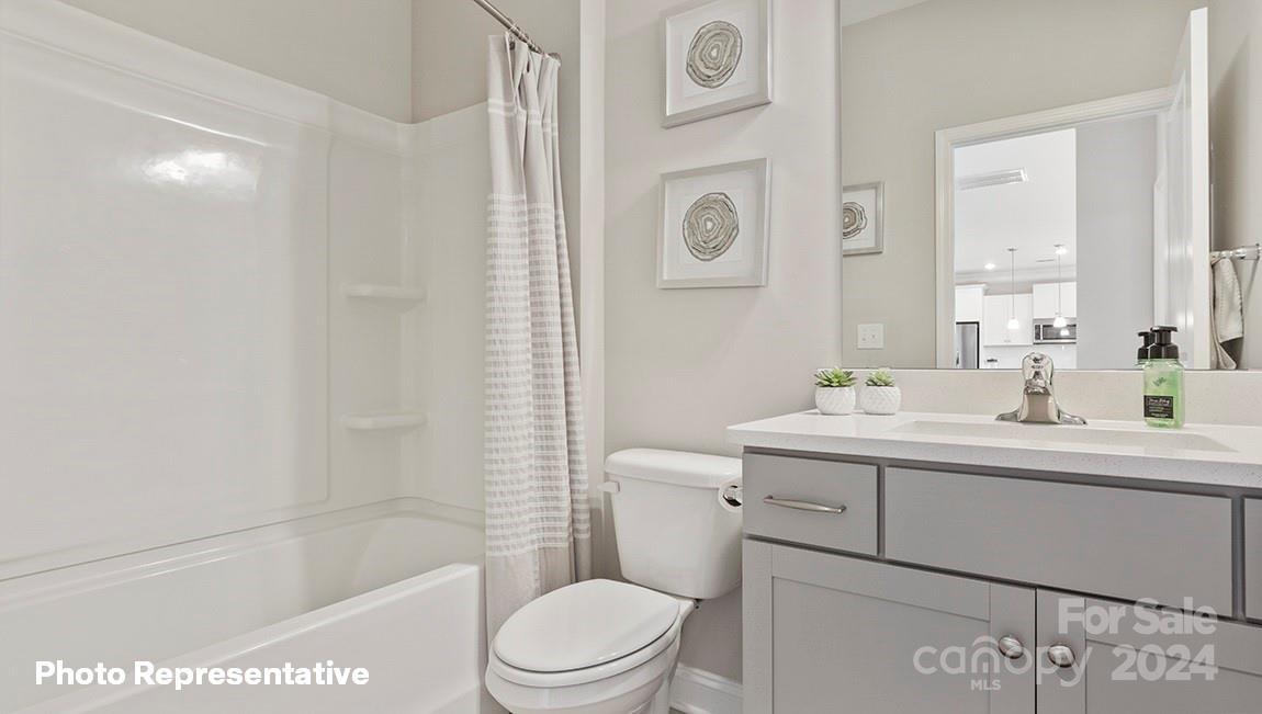 308 Streamwood Road Troutman, NC 28166 - Photo 9 of 39 a bathroom with a sink a toilet and shower