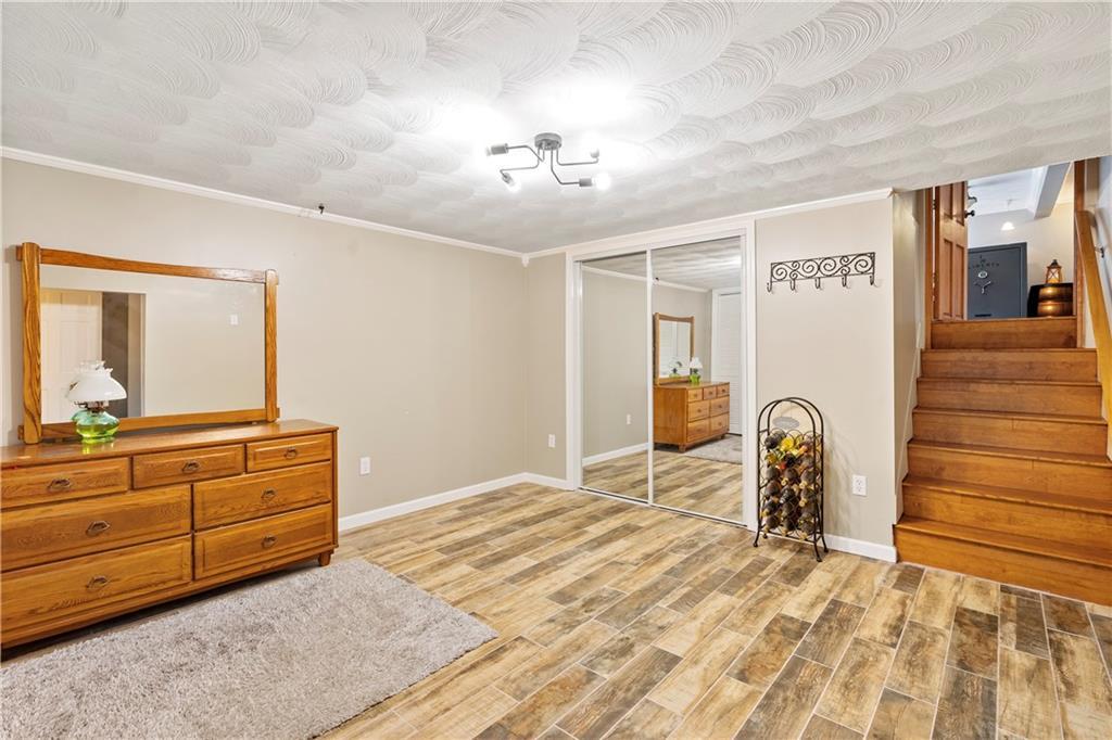 839 West Old Rte 422 Butler, PA 16001 - Photo 21 of 30 a bedroom with a bed and a dresser