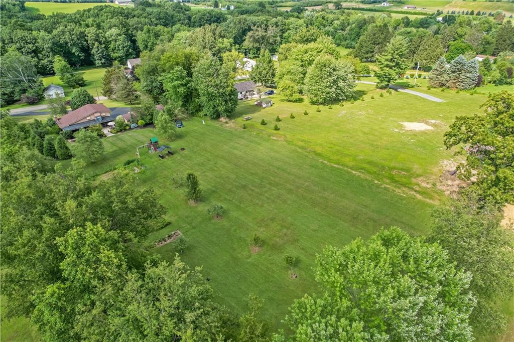 839 West Old Rte 422 Butler, PA 16001 - Photo 4 of 30 a view of a green yard with large trees