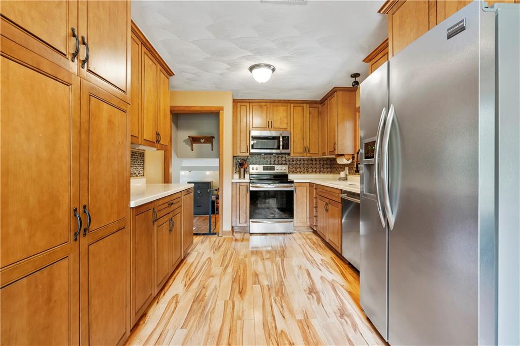 839 West Old Rte 422 Butler, PA 16001 - Photo 8 of 30 a kitchen with stainless steel appliances a refrigerator and a stove