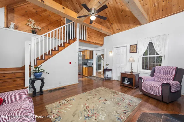 a view of livingroom with furniture and staircase