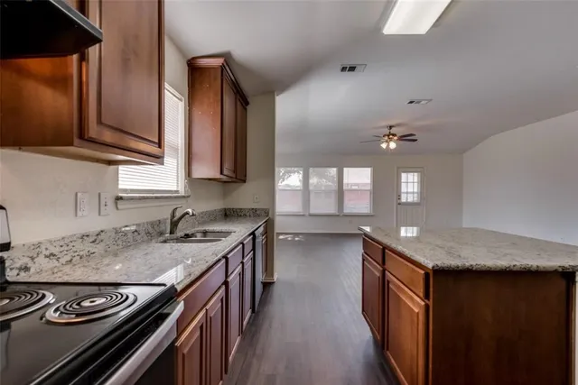 a kitchen with a stove and a sink