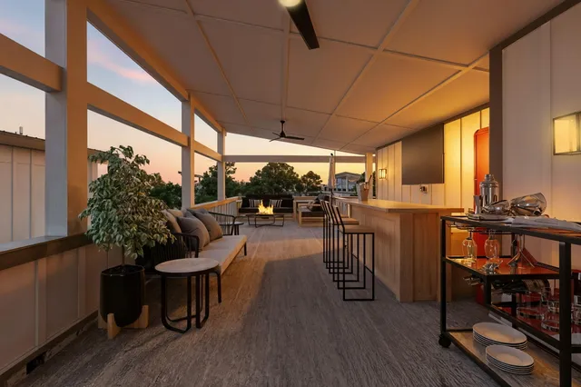 a view of a patio with table and chairs potted plants with wooden floor