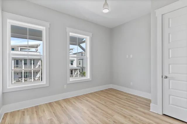 a balcony view with furniture and wooden floor