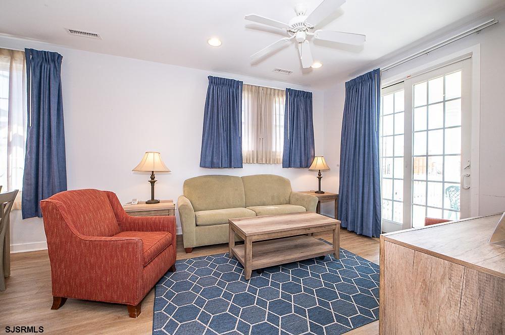 1001 Little Atlantic Avenue, Unit 373 Ocean City, NJ 08226 - Photo 11 of 27 a living room with furniture and a large window