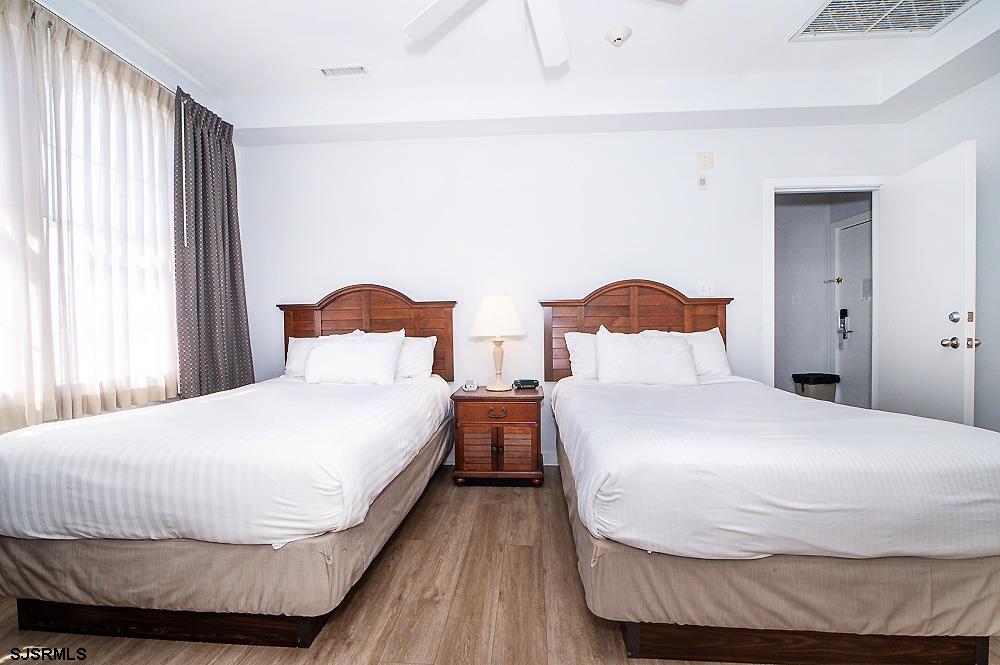 1001 Little Atlantic Avenue, Unit 373 Ocean City, NJ 08226 - Photo 21 of 27 a bedroom with two beds and a window
