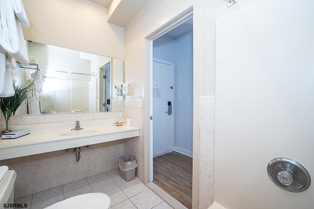 1001 Little Atlantic Avenue, Unit 373 Ocean City, NJ 08226 - Photo 23 of 27 a bathroom with a sink and a mirror