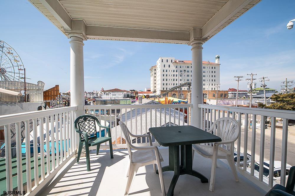 1001 Little Atlantic Avenue, Unit 373 Ocean City, NJ 08226 - Photo 25 of 27 a view of a chairs and table in the balcony