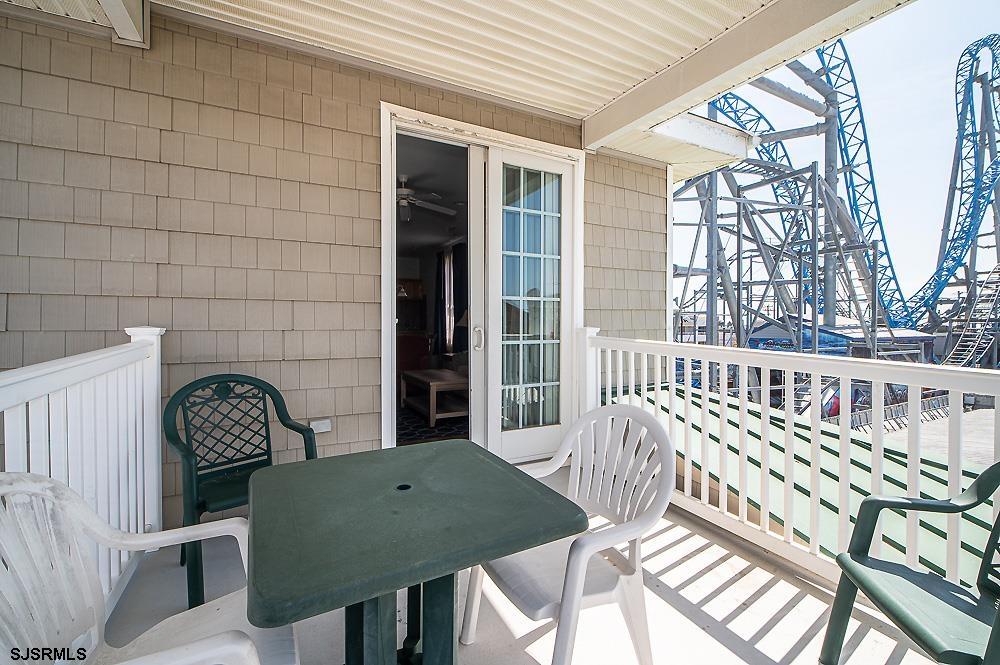 1001 Little Atlantic Avenue, Unit 373 Ocean City, NJ 08226 - Photo 26 of 27 a view of a chairs and a table in the patio