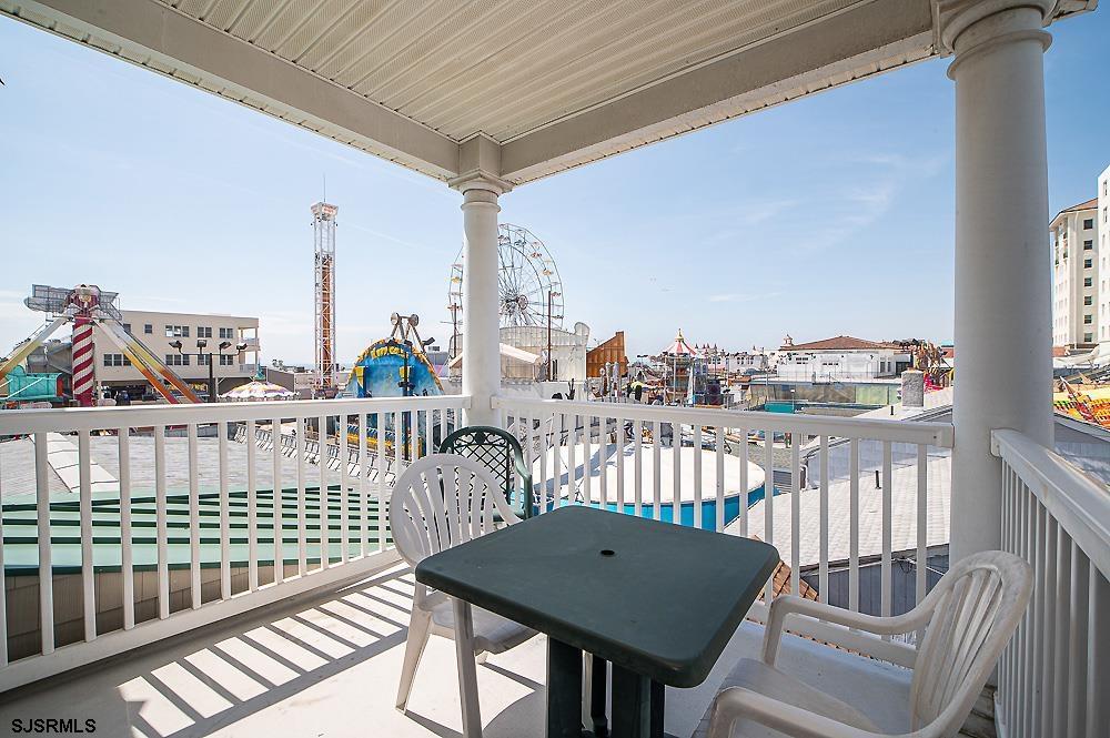 1001 Little Atlantic Avenue, Unit 373 Ocean City, NJ 08226 - Photo 27 of 27 a view of a balcony with two chairs and a table