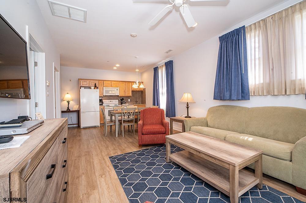 1001 Little Atlantic Avenue, Unit 373 Ocean City, NJ 08226 - Photo 8 of 27 a living room with furniture and a large window