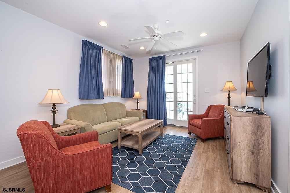 1001 Little Atlantic Avenue, Unit 373 Ocean City, NJ 08226 - Photo 10 of 27 a living room with furniture a ceiling fan and a window