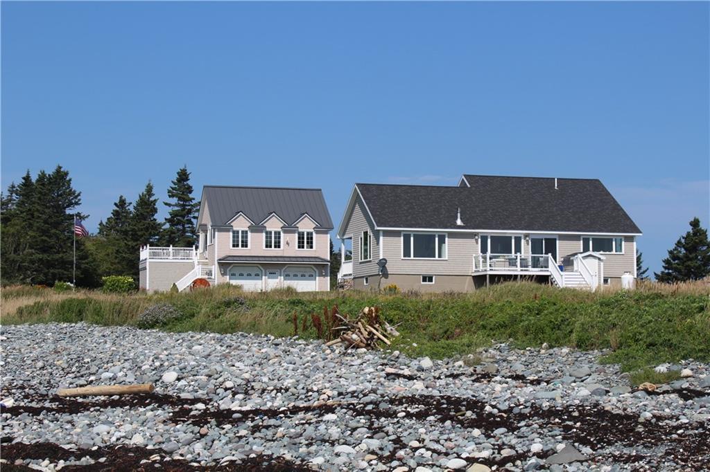 98 Carrying Place Cove Road Lubec, ME 04652 - Photo 6 of 35 View of the homes from the beach.