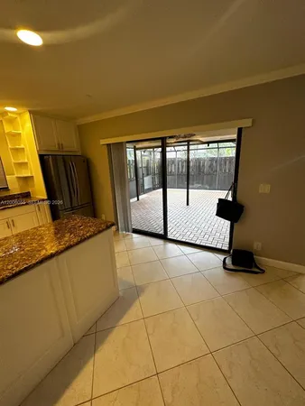 a view of a kitchen with a sink and a window