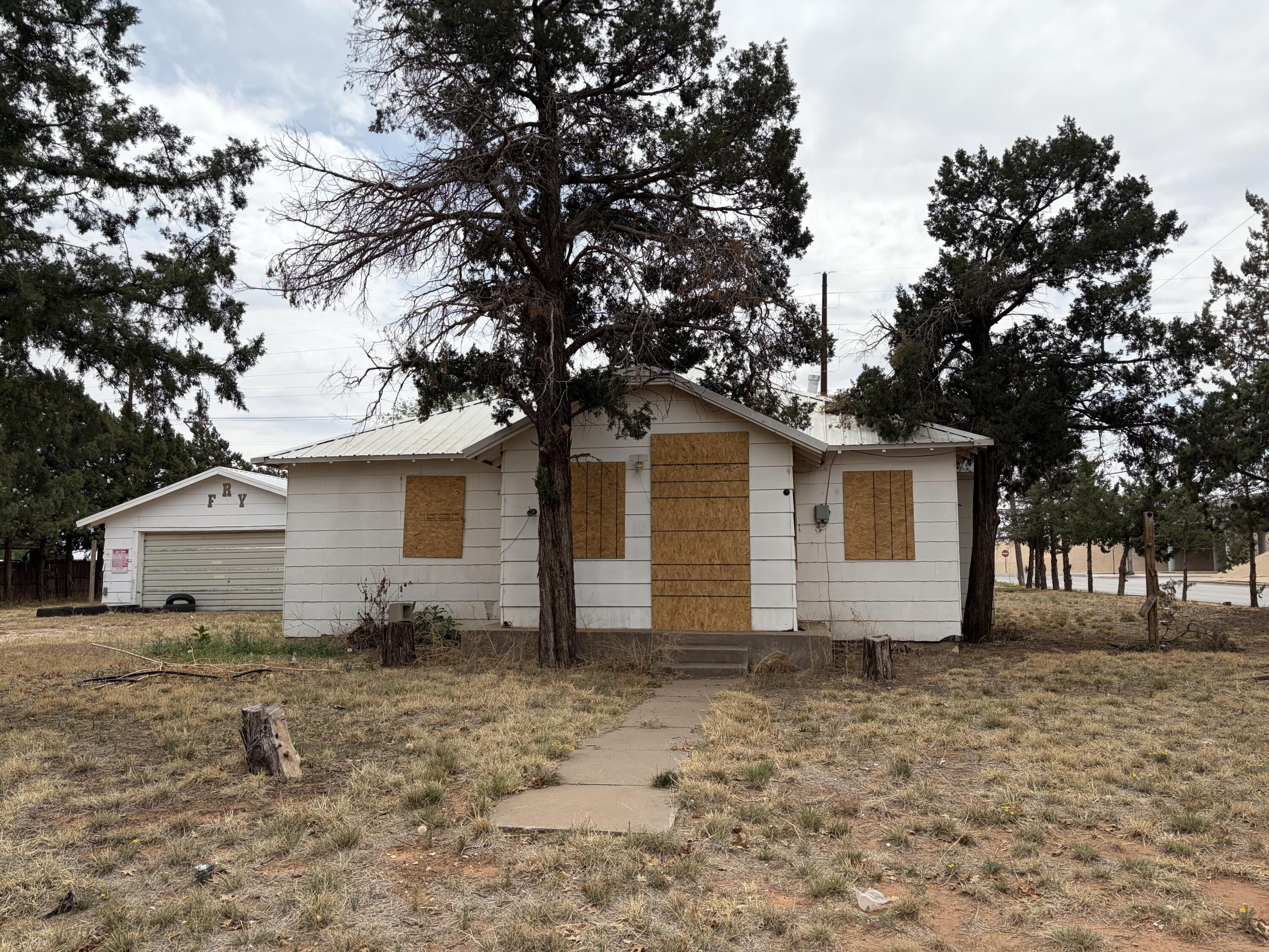 709 81st Street Lubbock, TX 79404 - Photo 1 of 3 a house that has a tree in front of the house
